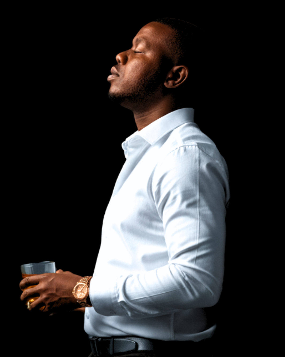 Olofinyo Temitope Ben in profile, eyes closed, holding a glass